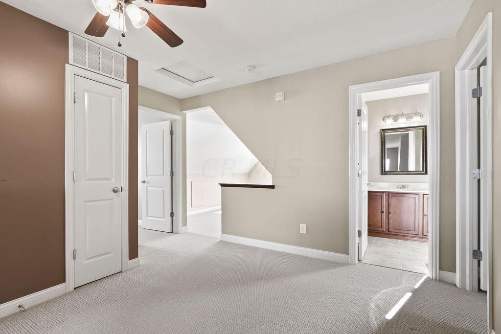 6163 Jennis Road Westerville, OH 43081 - Photo 26 of 44 • Tan carpet
• Tan painted walls
• Lighted ceiling fan
• Linen closet