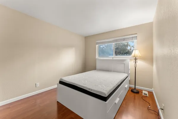 a bedroom with a bed and a closet