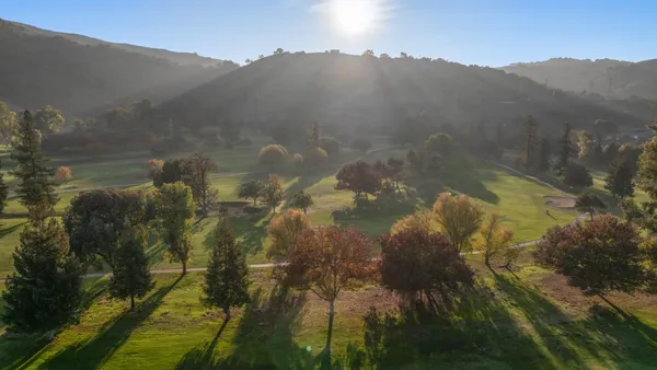 a view of a chairs and table in patio