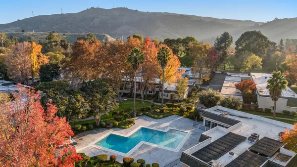 an aerial view of residential house with outdoor space