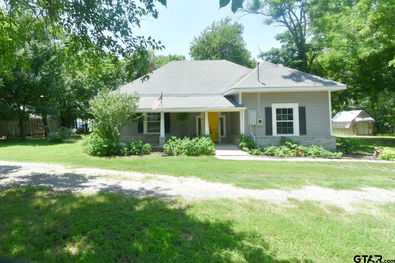 370 Spur 514 Yantis, TX 75497 - Photo 1 of 38 a view of a house with a yard and potted plants