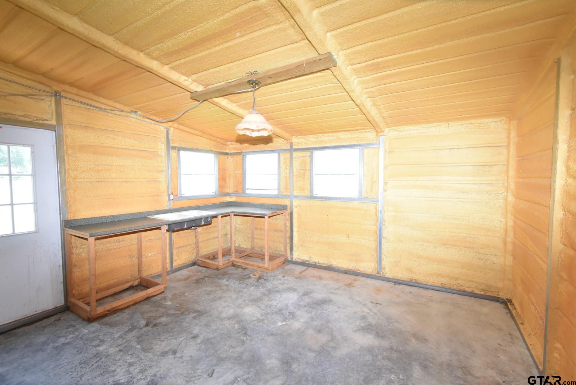 370 Spur 514 Yantis, TX 75497 - Photo 11 of 38 an empty room with windows