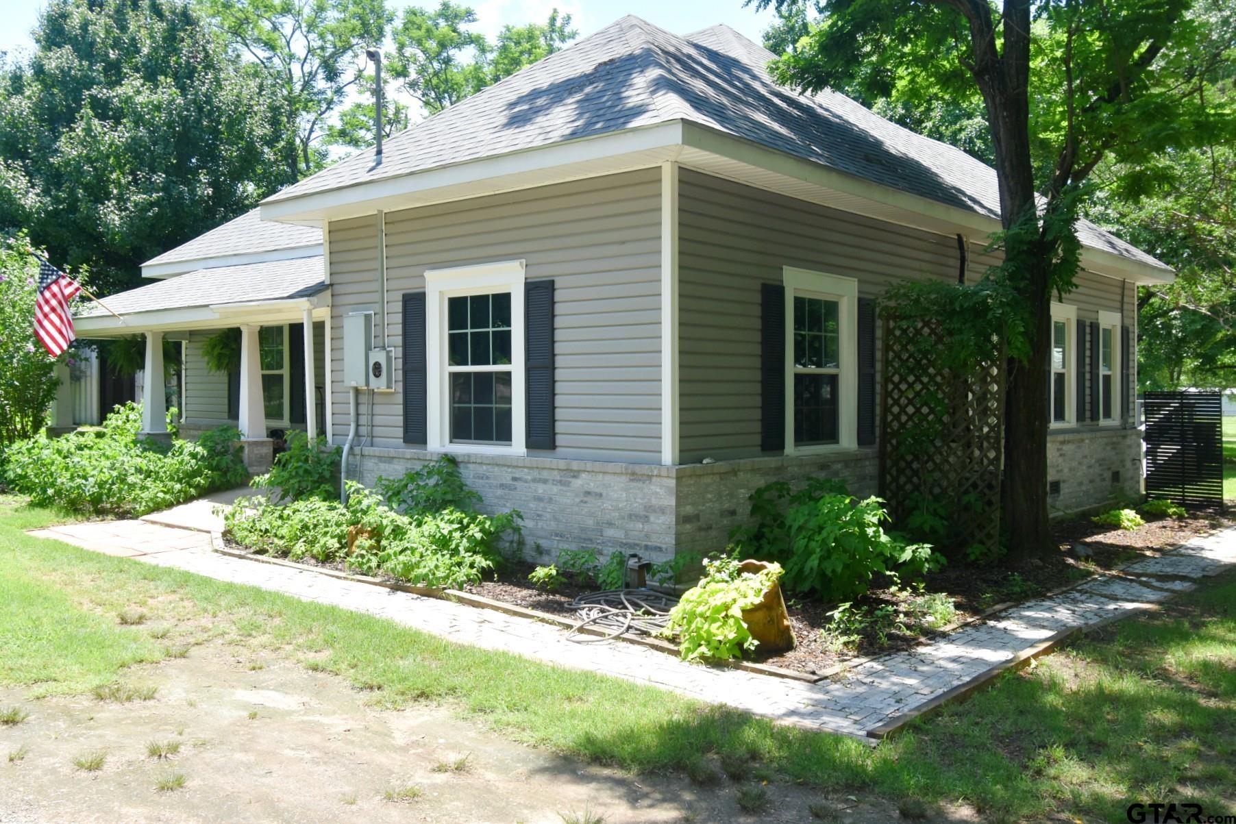 370 Spur 514 Yantis, TX 75497 - Photo 2 of 38 a front view of a house with a yard