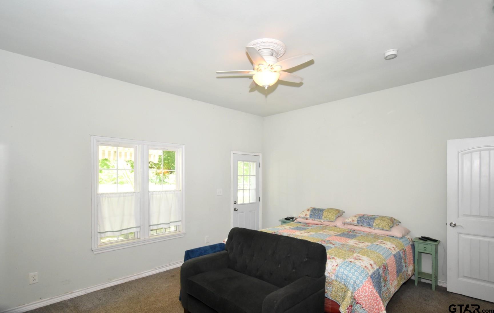 370 Spur 514 Yantis, TX 75497 - Photo 24 of 38 a bedroom with a bed and a window