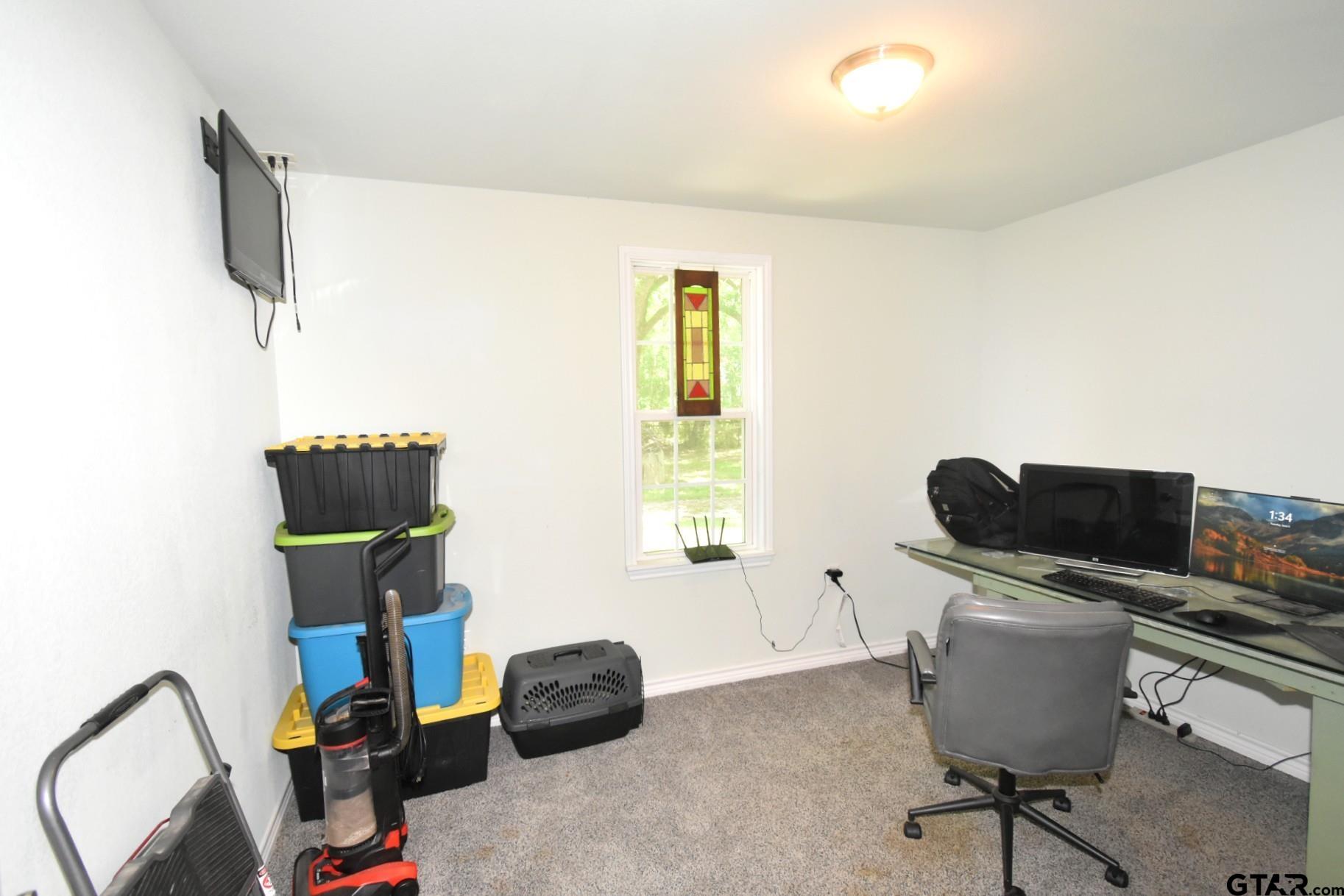 370 Spur 514 Yantis, TX 75497 - Photo 30 of 38 a work room with furniture and a flat screen tv