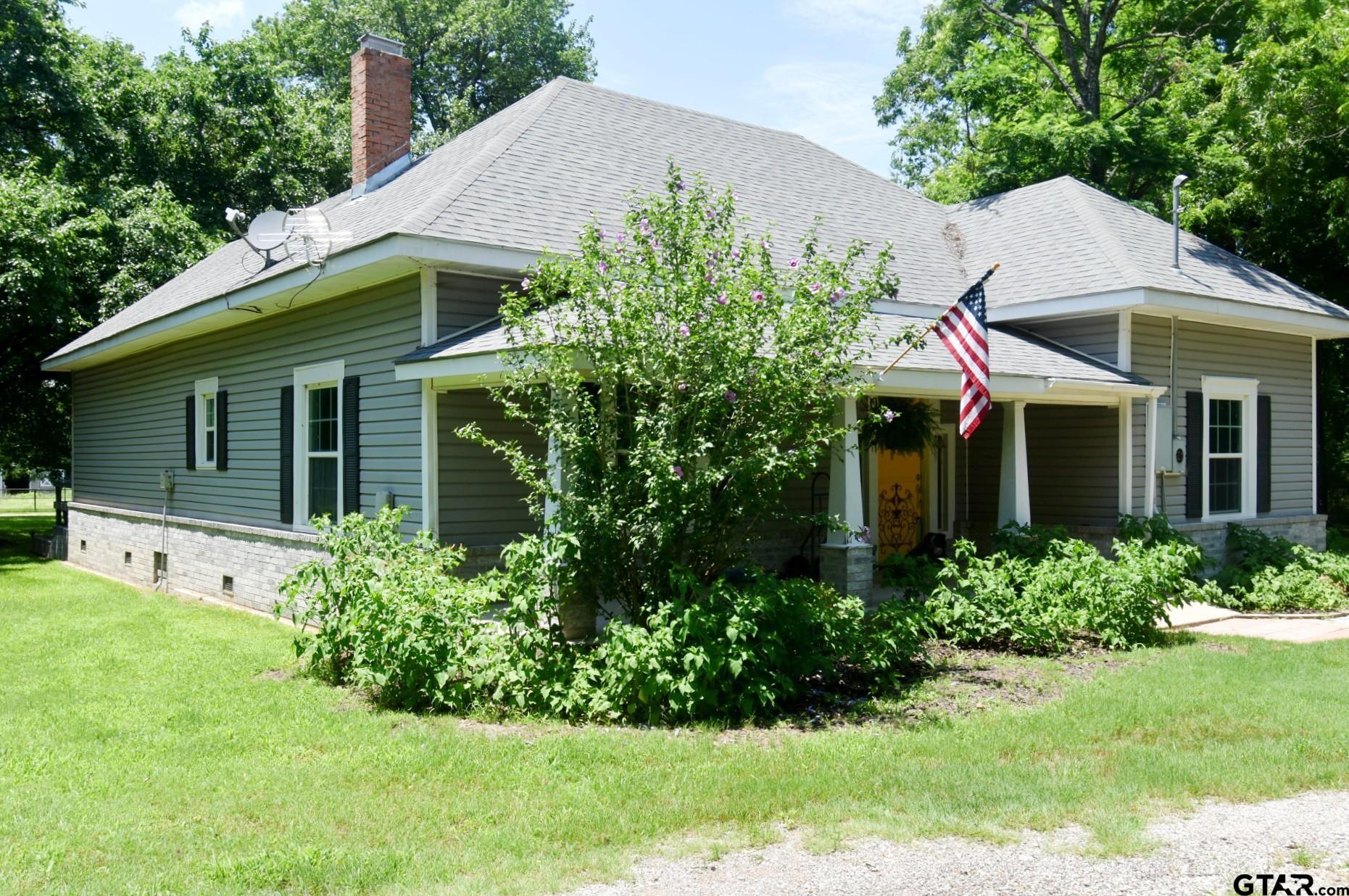 370 Spur 514 Yantis, TX 75497 - Photo 3 of 38 a view of a house with a yard and plants