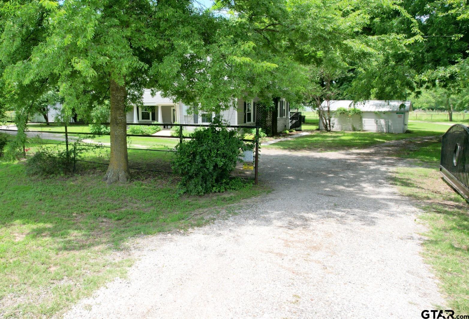 370 Spur 514 Yantis, TX 75497 - Photo 35 of 38 a front view of a house with a yard