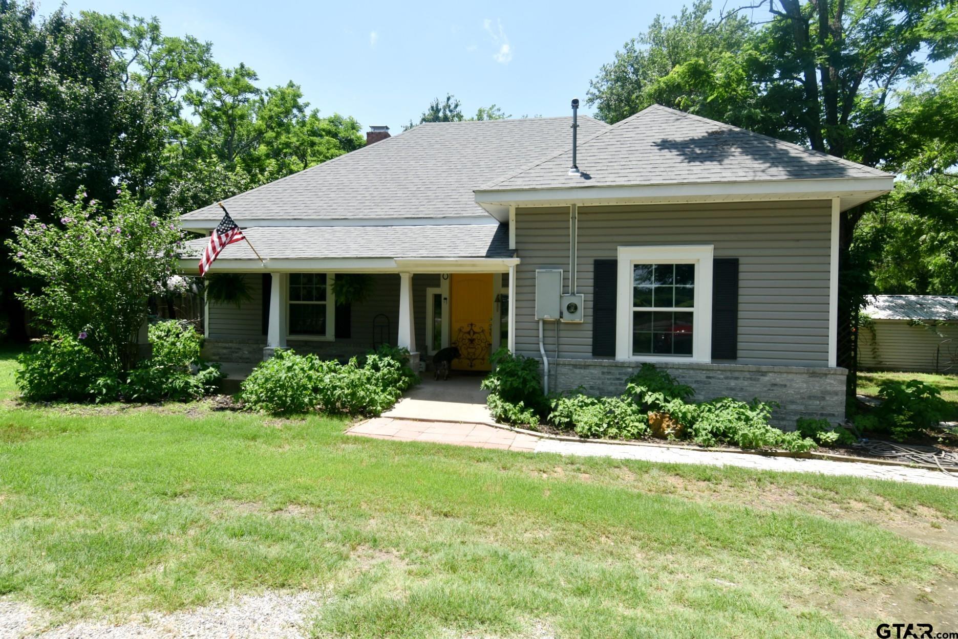 370 Spur 514 Yantis, TX 75497 - Photo 36 of 38 a front view of a house with a yard and porch