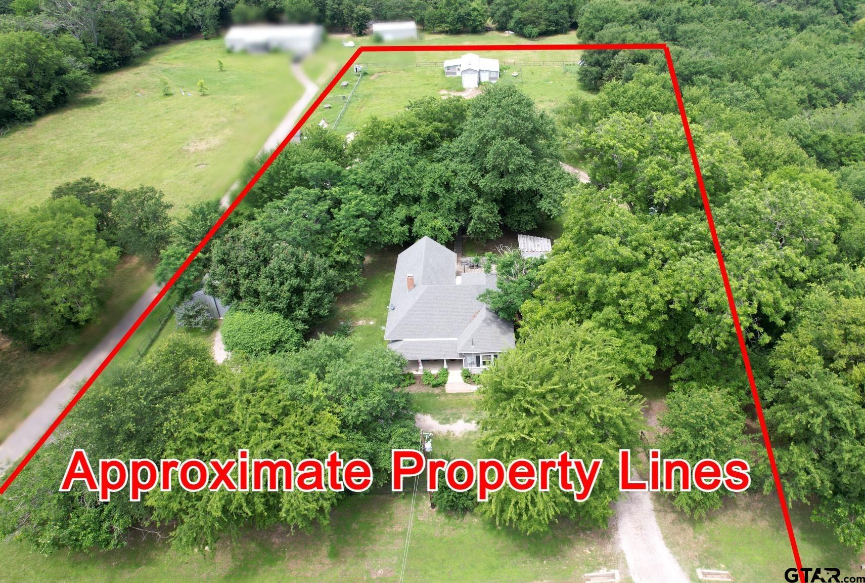 370 Spur 514 Yantis, TX 75497 - Photo 38 of 38 a sign that is sitting on a wooden fence