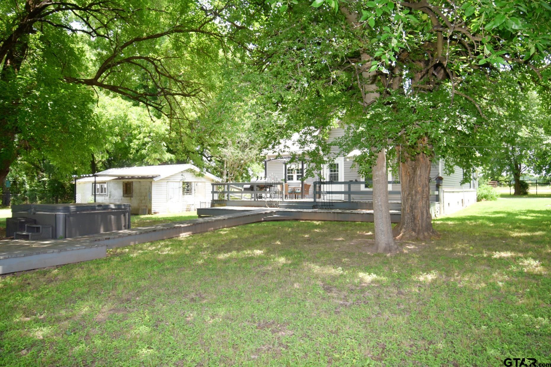 370 Spur 514 Yantis, TX 75497 - Photo 4 of 38 a view of a house with a yard balcony and tree