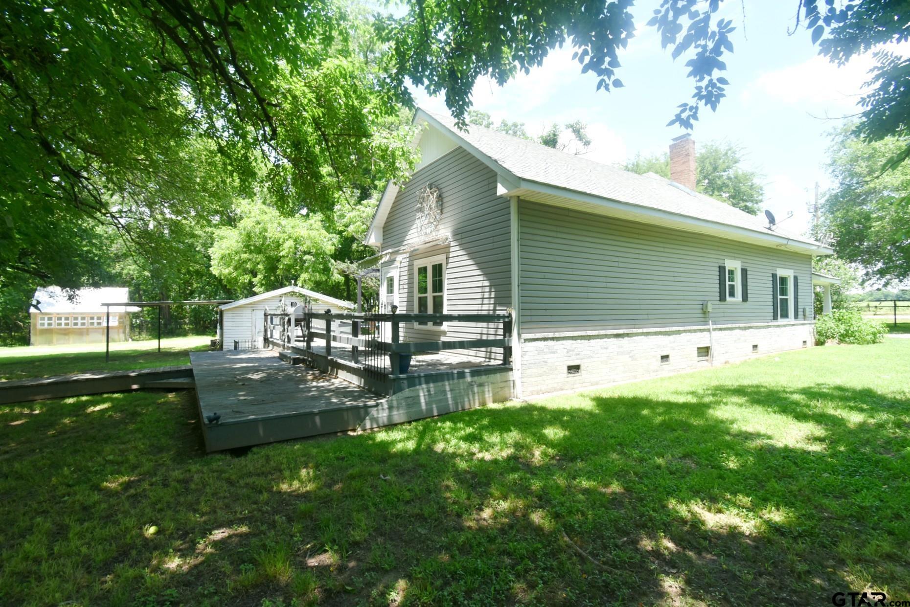 370 Spur 514 Yantis, TX 75497 - Photo 7 of 38 a front view of a house with garden