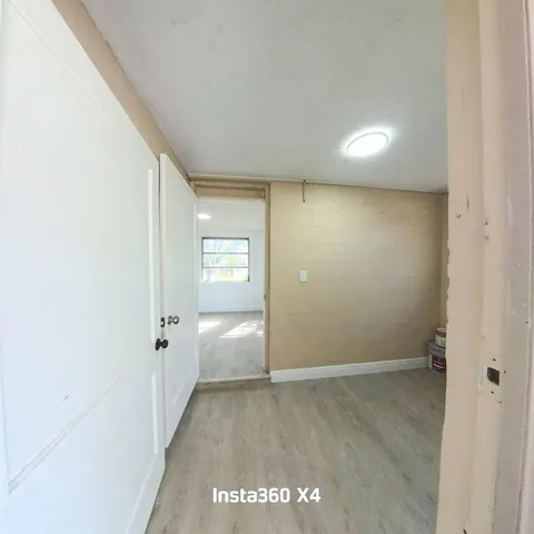 a view of an empty room with a ocean view