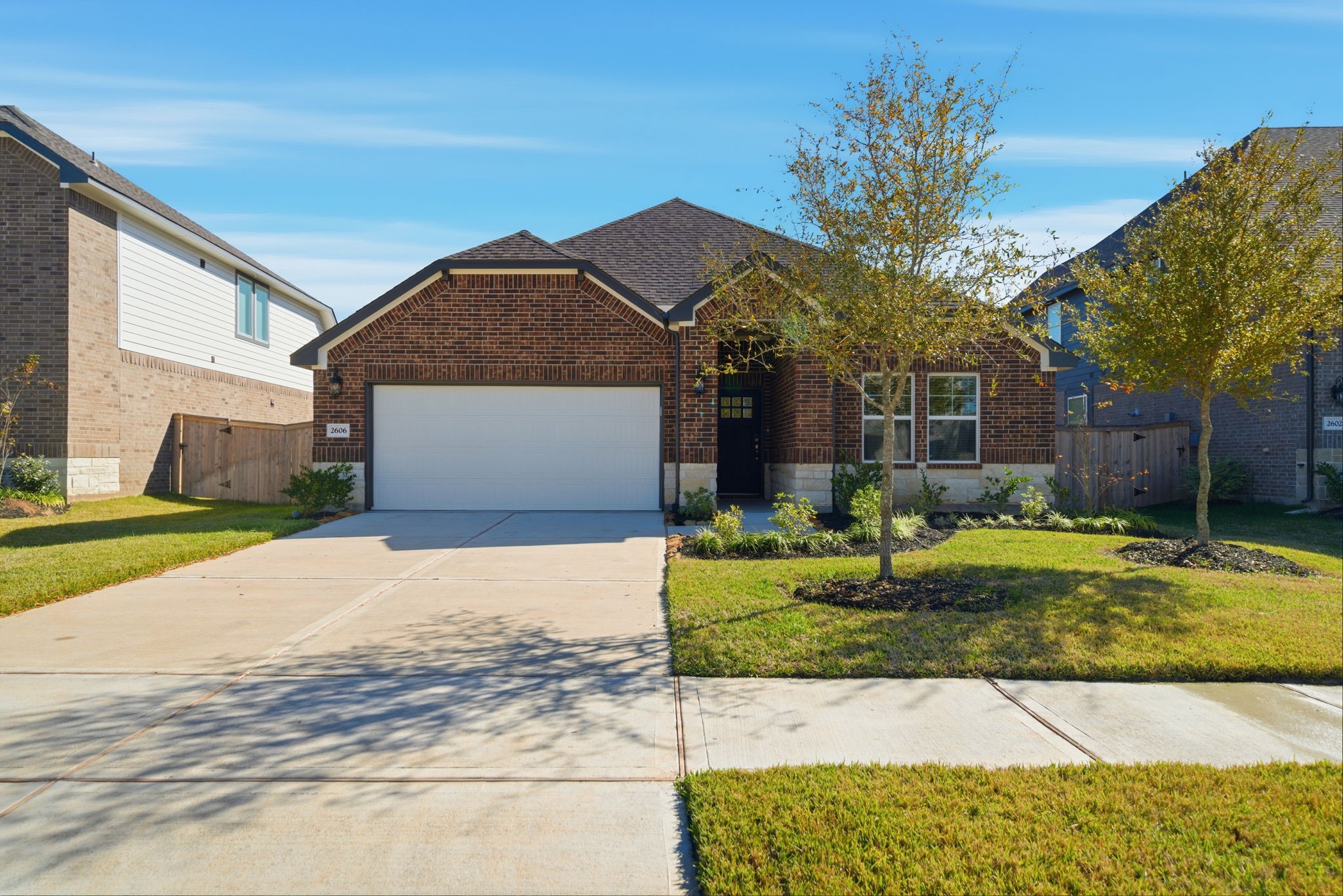 2606 Good Morrow Drive Rosenberg, TX 77471 - Photo 2 of 23 a front view of a house with garden