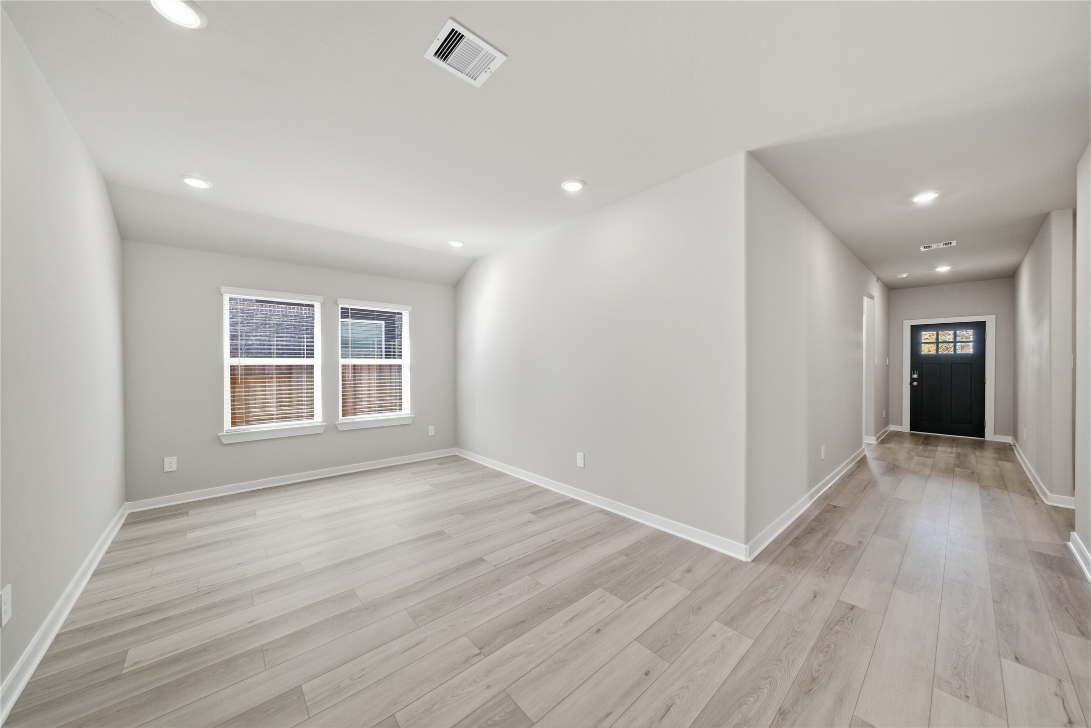 2606 Good Morrow Drive Rosenberg, TX 77471 - Photo 3 of 23 wooden floor in an empty room with a window