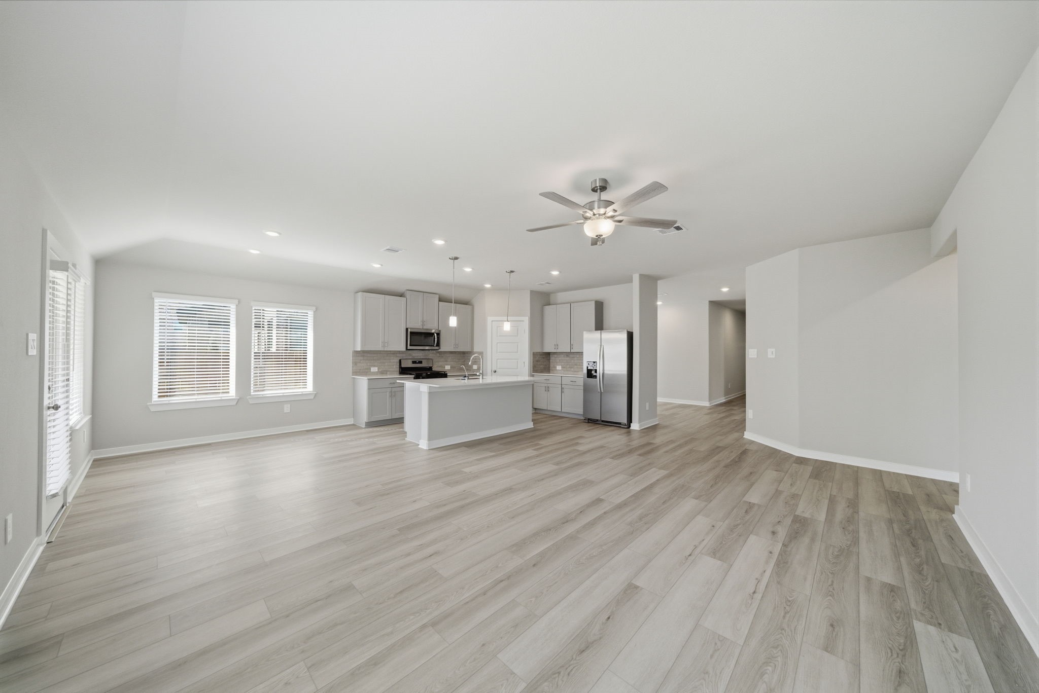 2606 Good Morrow Drive Rosenberg, TX 77471 - Photo 6 of 23 a view of an empty room with wooden floor and a window
