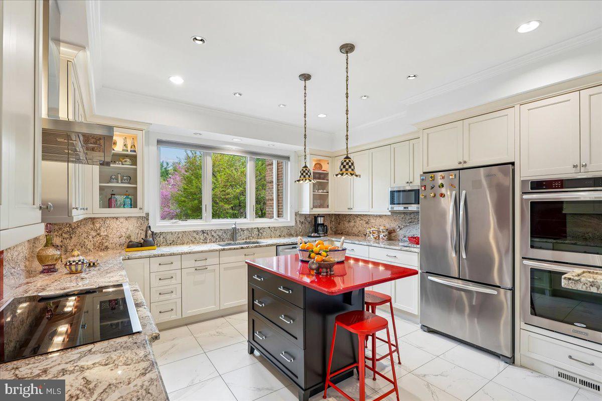 12640 Travilah Road Potomac, MD 20854 - Photo 15 of 56 All remodeled kitchen w/pendant lights