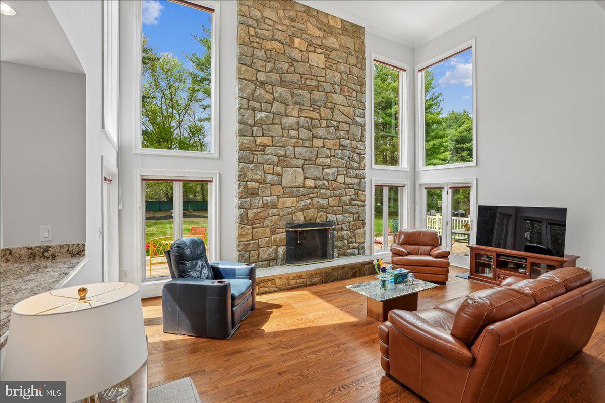 12640 Travilah Road Potomac, MD 20854 - Photo 22 of 56 Soaring two story fireplace is a standout feature