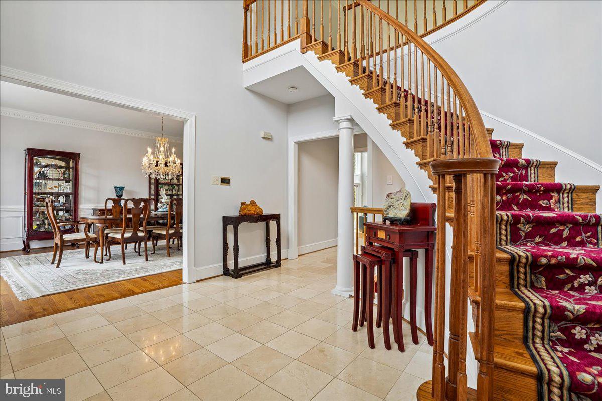 12640 Travilah Road Potomac, MD 20854 - Photo 6 of 56 Sweeping staircase and foyer
