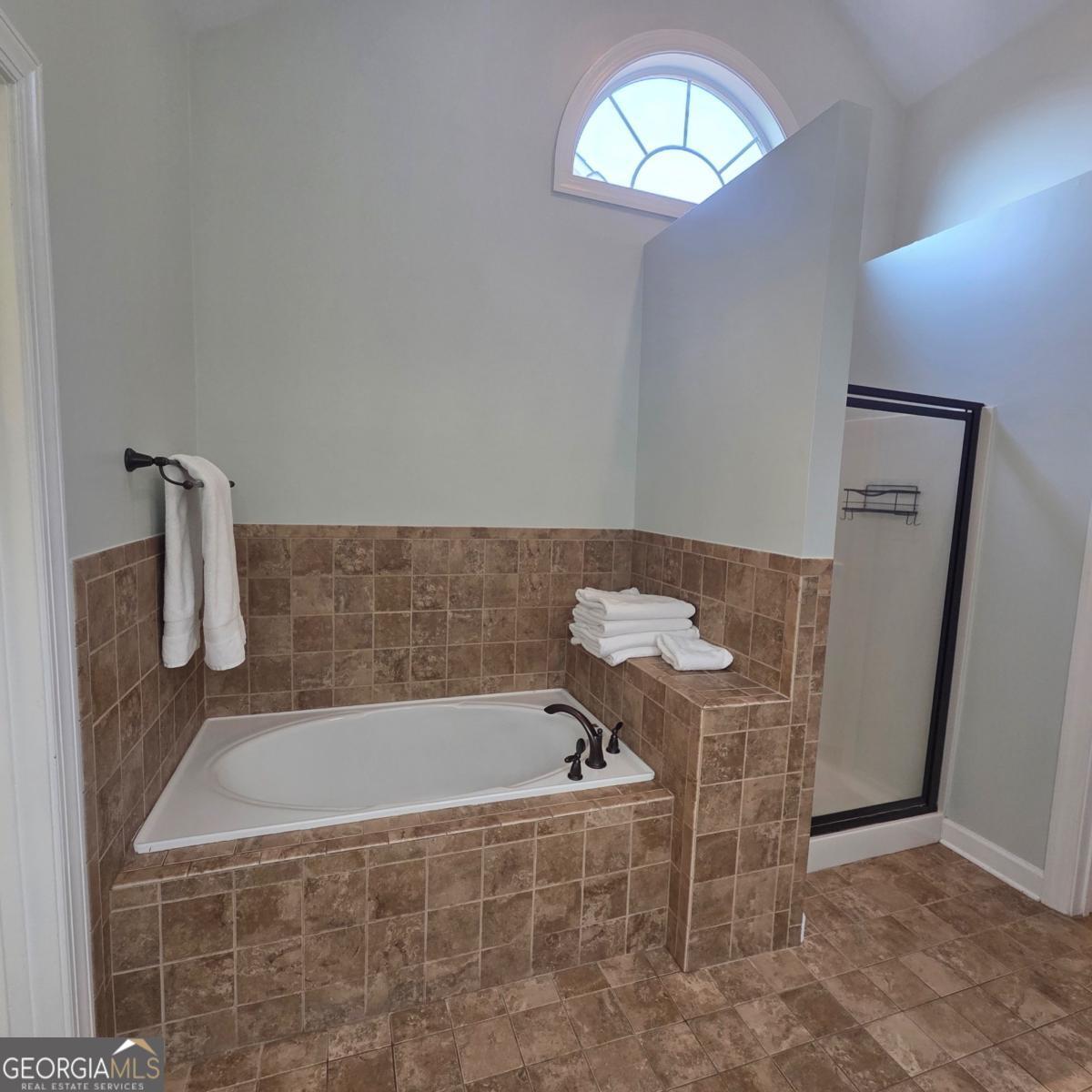 105 Cottage Grove Peachtree City, GA 30269 - Photo 13 of 13 a bathroom with a bathtub and a shower