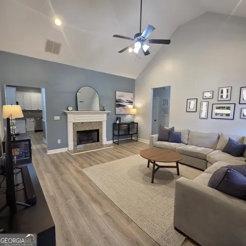 a living room with furniture and a fireplace