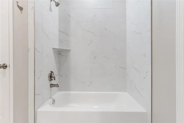 a close up of a bathtub curtain