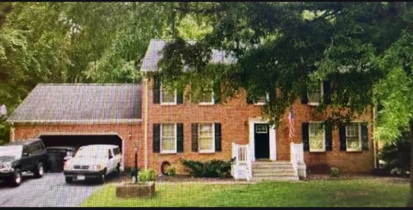 a view of a car parked in front of a house