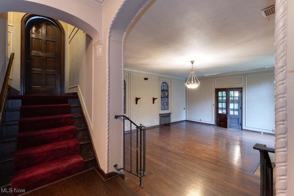 569 Merriman Road Akron, OH 44303 - Photo 6 of 43 Staircase with ornamental molding and wood-type flooring
