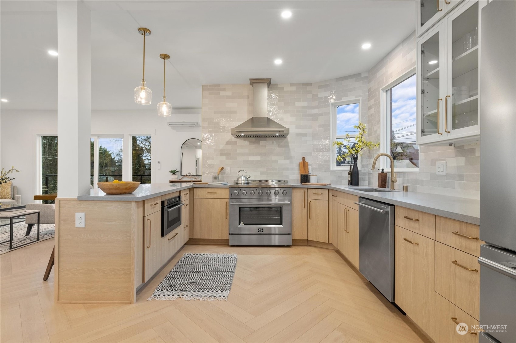 3934 Interlake Avenue North Seattle, WA 98103 - Photo 11 of 40 a kitchen with stainless steel appliances granite countertop a stove and a sink