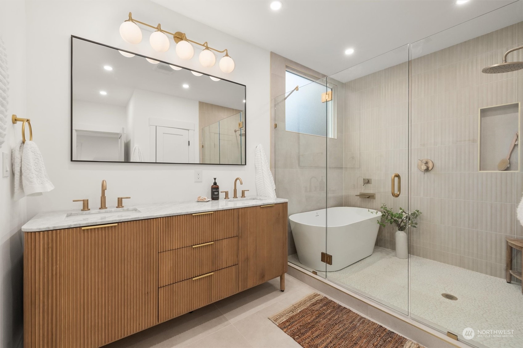 3934 Interlake Avenue North Seattle, WA 98103 - Photo 17 of 40 a bathroom with a sink and a mirror
