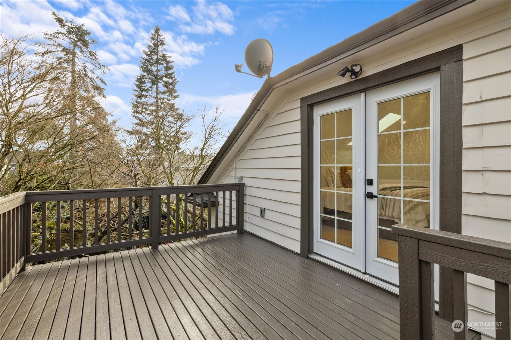 3934 Interlake Avenue North Seattle, WA 98103 - Photo 24 of 40 a view of a balcony with wooden floor and fence