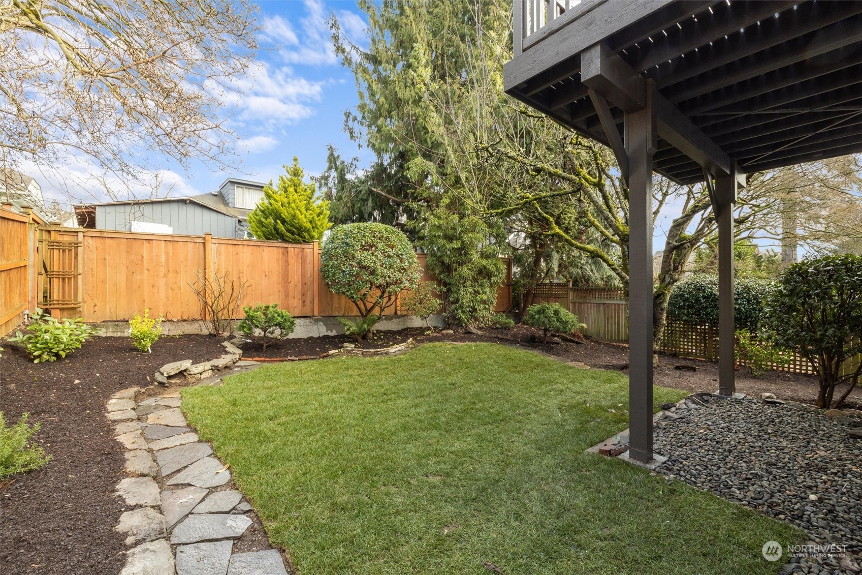 3934 Interlake Avenue North Seattle, WA 98103 - Photo 35 of 40 a backyard of a house with lots of green space