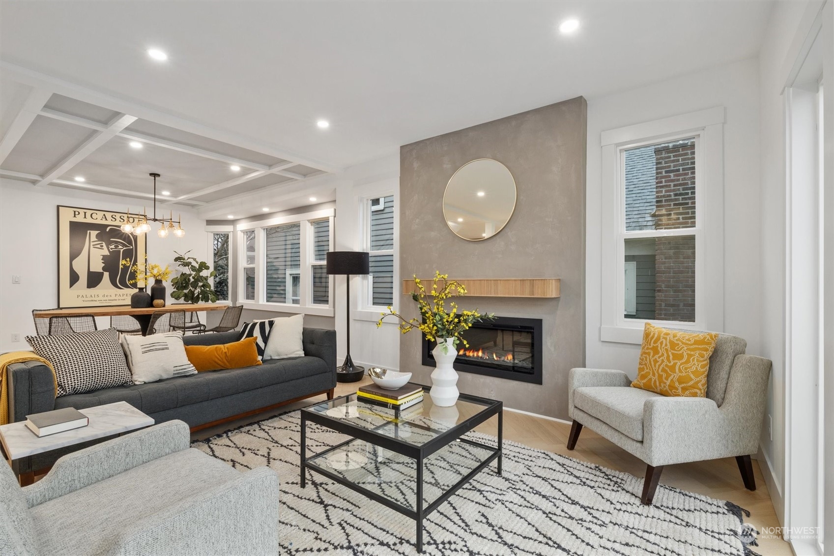 3934 Interlake Avenue North Seattle, WA 98103 - Photo 5 of 40 a living room with furniture kitchen view and a fireplace
