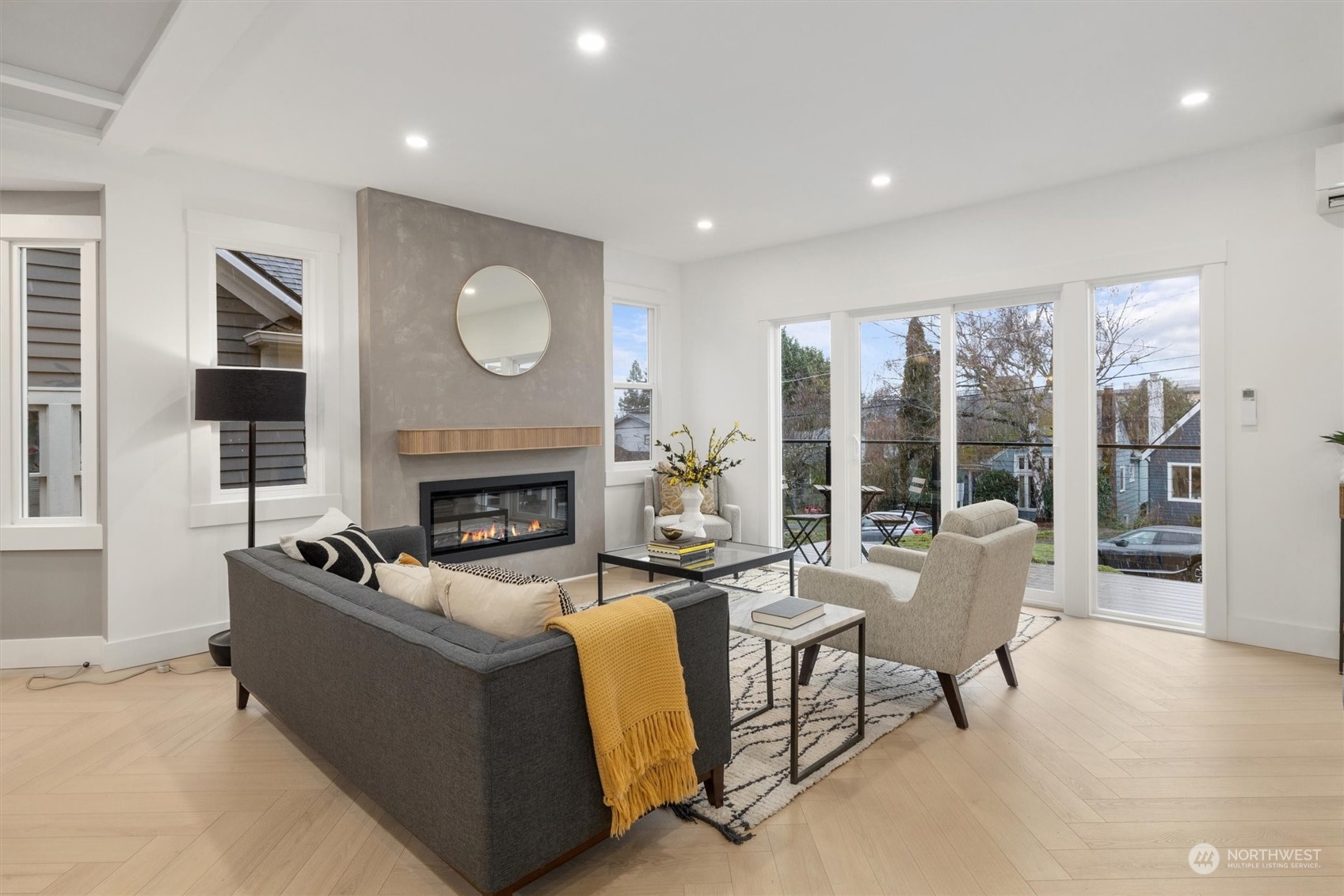 3934 Interlake Avenue North Seattle, WA 98103 - Photo 6 of 40 a living room with furniture and a fireplace