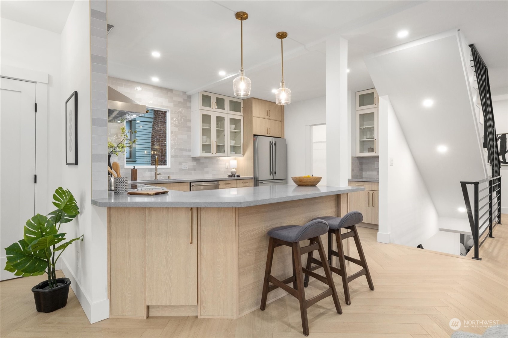 3934 Interlake Avenue North Seattle, WA 98103 - Photo 8 of 40 a kitchen with granite countertop white cabinets and chairs