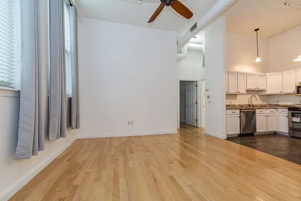 a view of a kitchen with wooden floor