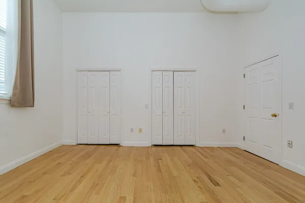 a bathroom with a sink a light fixture and a toilet