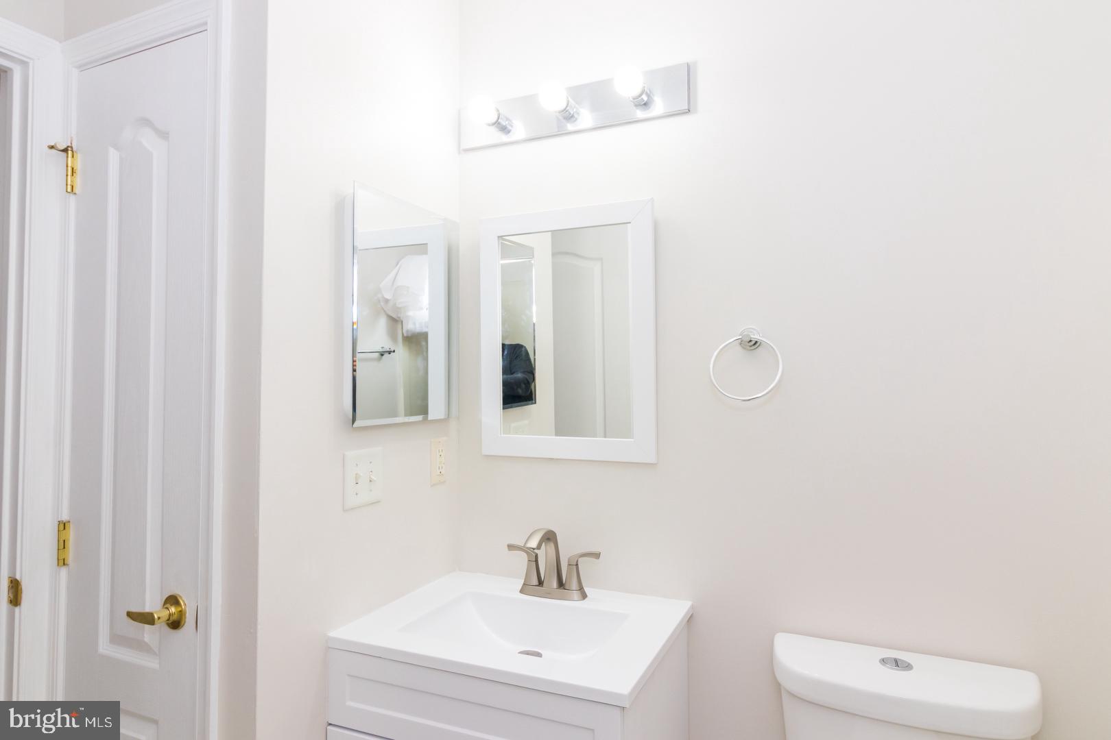 226 Hawthorne Way Riverside, NJ 08075 - Photo 28 of 32 a bathroom with a sink a toilet and a mirror