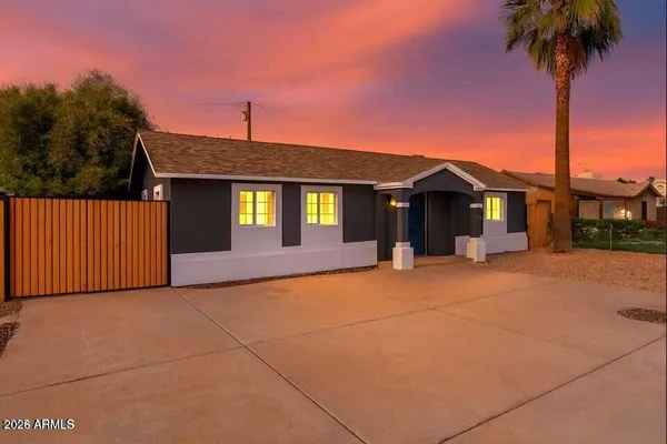 front view of a house with a yard