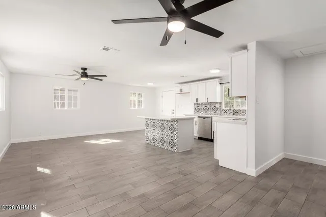 a view of a kitchen with a sink cabinets and window