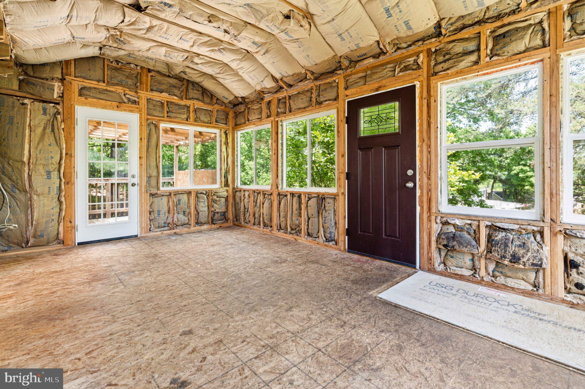 7845 Metacomet Road Hanover, MD 21076 - Photo 16 of 19 a view of a room with wooden walls and iron stairs