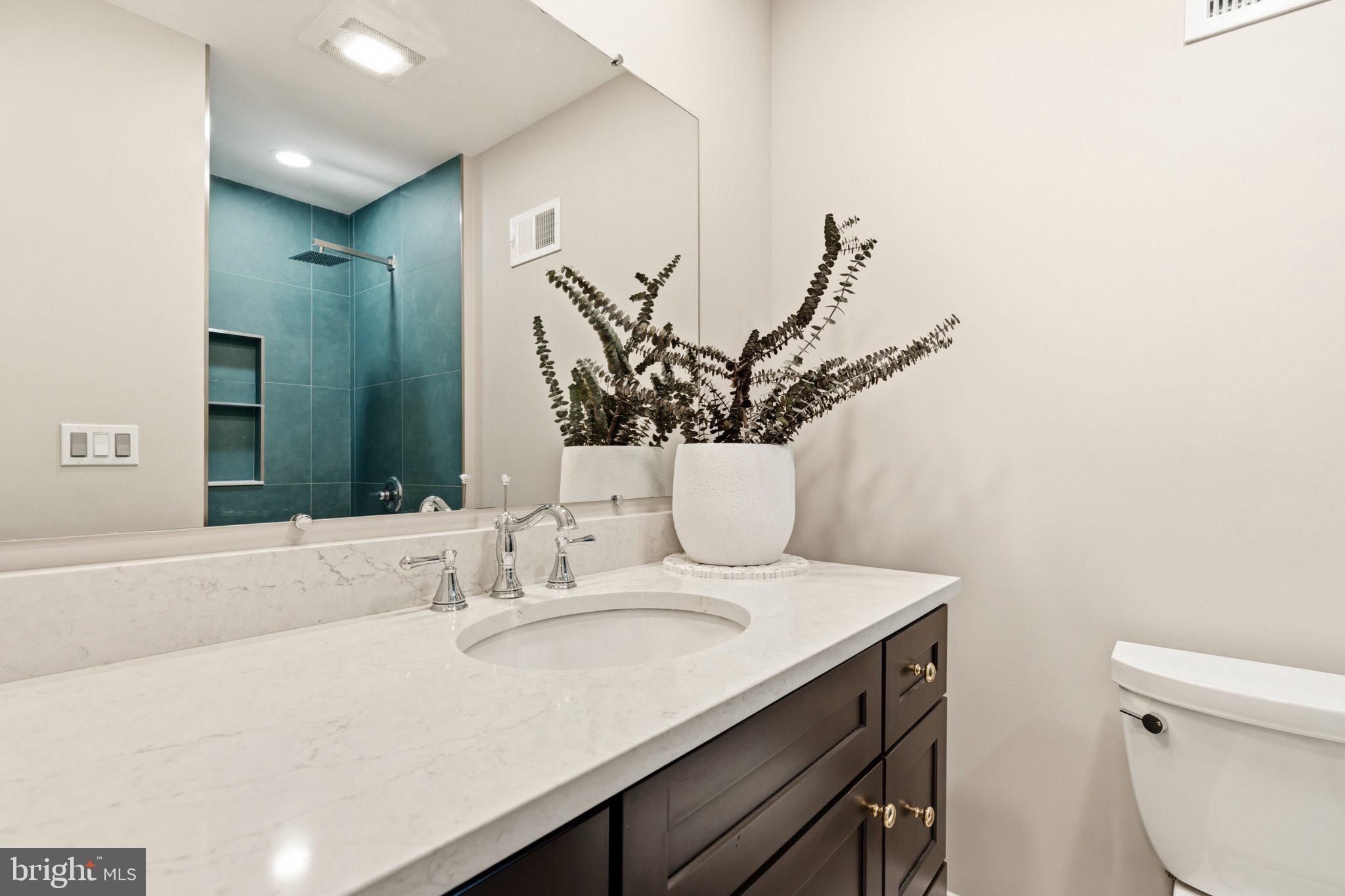 7845 Metacomet Road Hanover, MD 21076 - Photo 19 of 19 a bathroom with a sink and a mirror