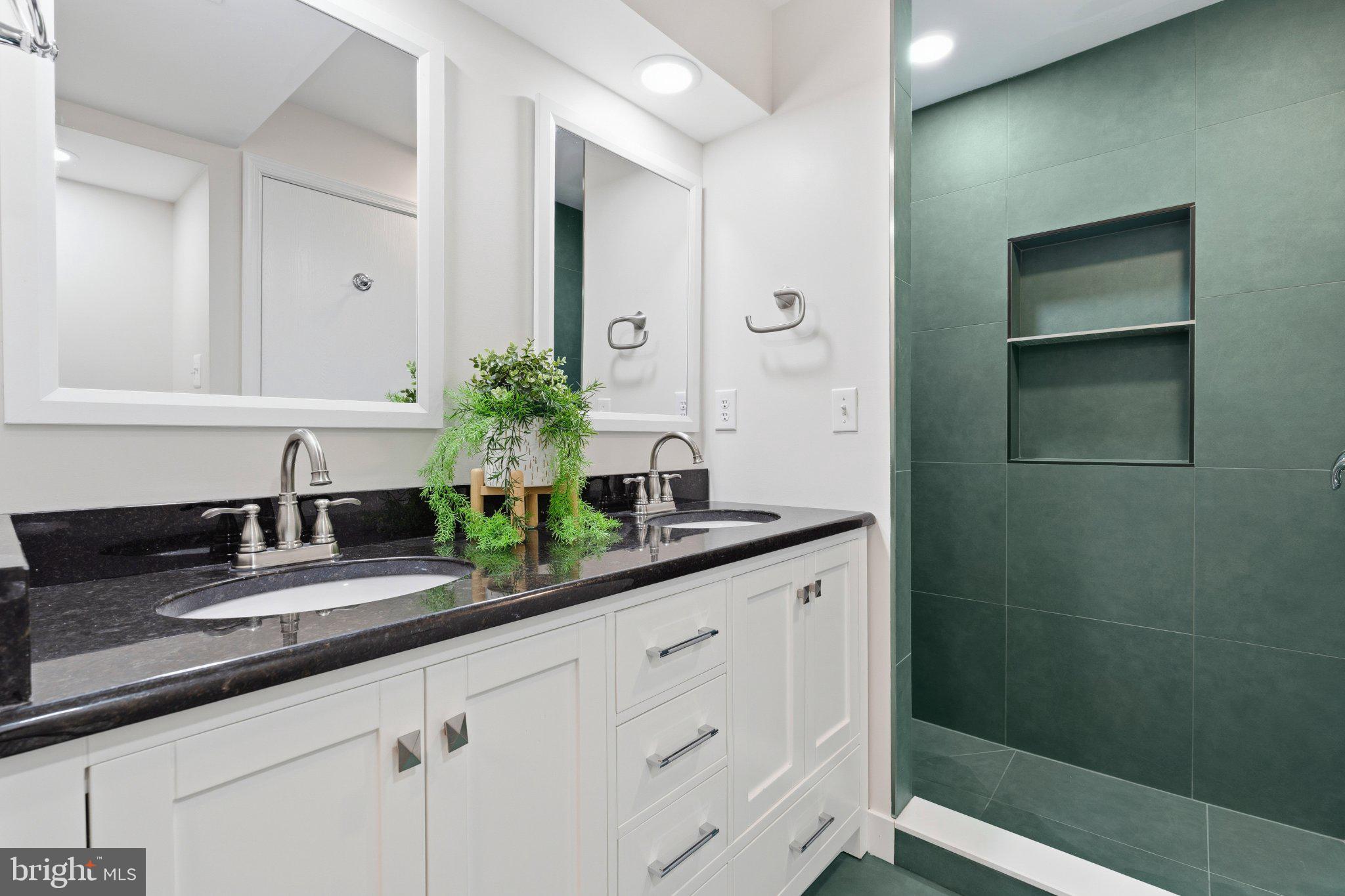 7845 Metacomet Road Hanover, MD 21076 - Photo 2 of 5 Sleek modern bathroom with elegant finishes.