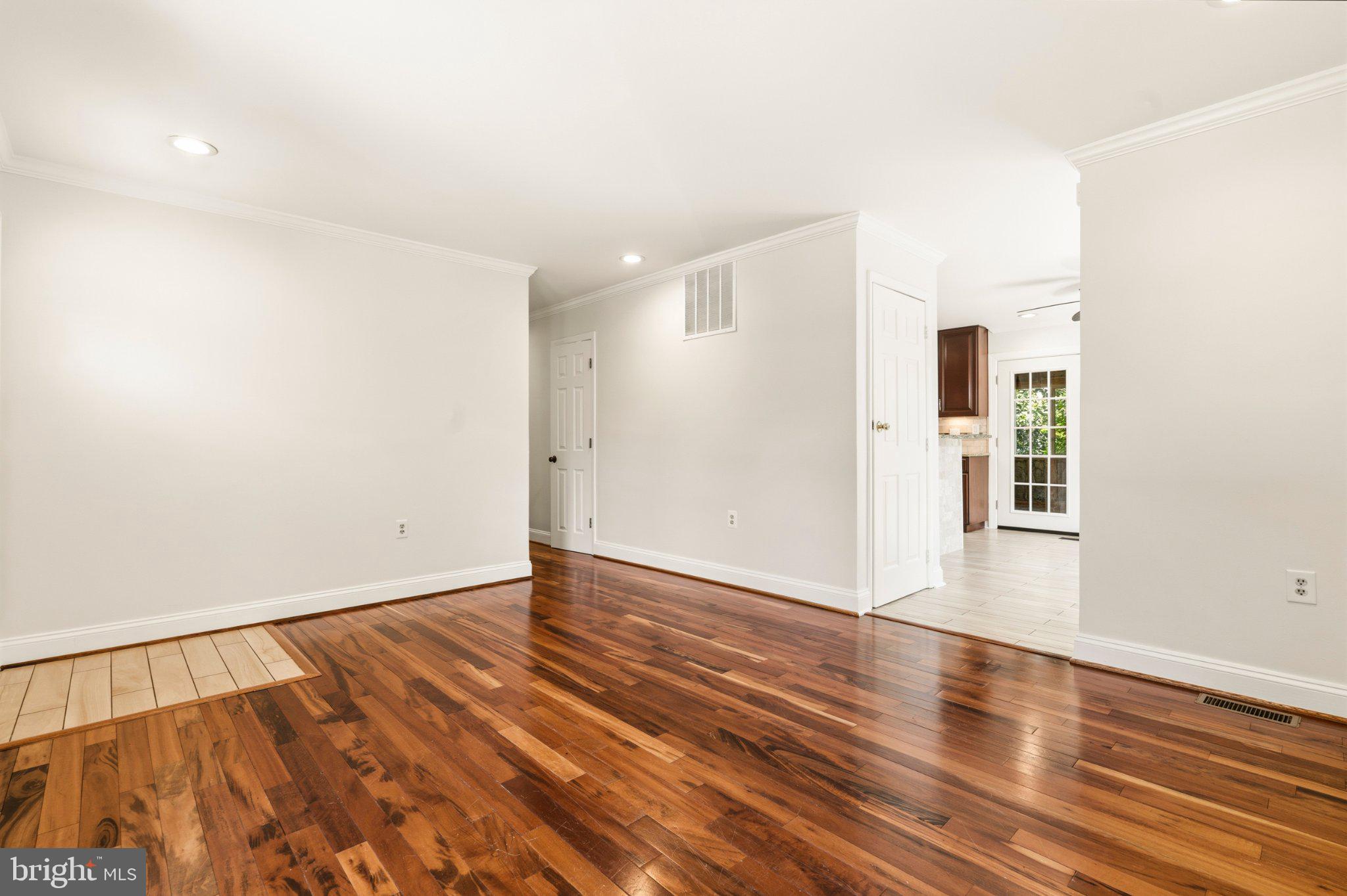 7845 Metacomet Road Hanover, MD 21076 - Photo 3 of 19 a view of an empty room with wooden floor