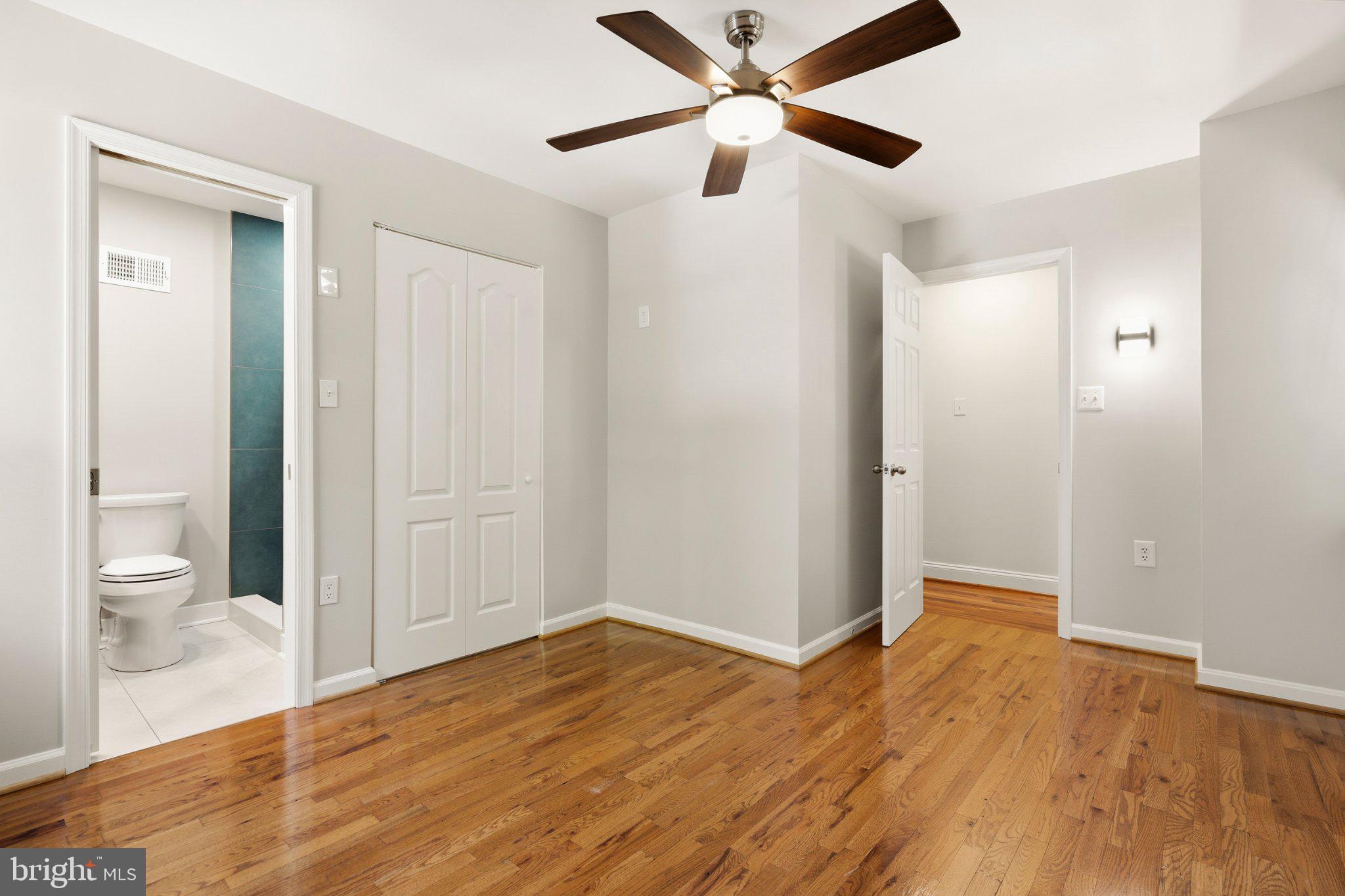 7845 Metacomet Road Hanover, MD 21076 - Photo 5 of 19 a view of a room with wooden floor and a bathroom