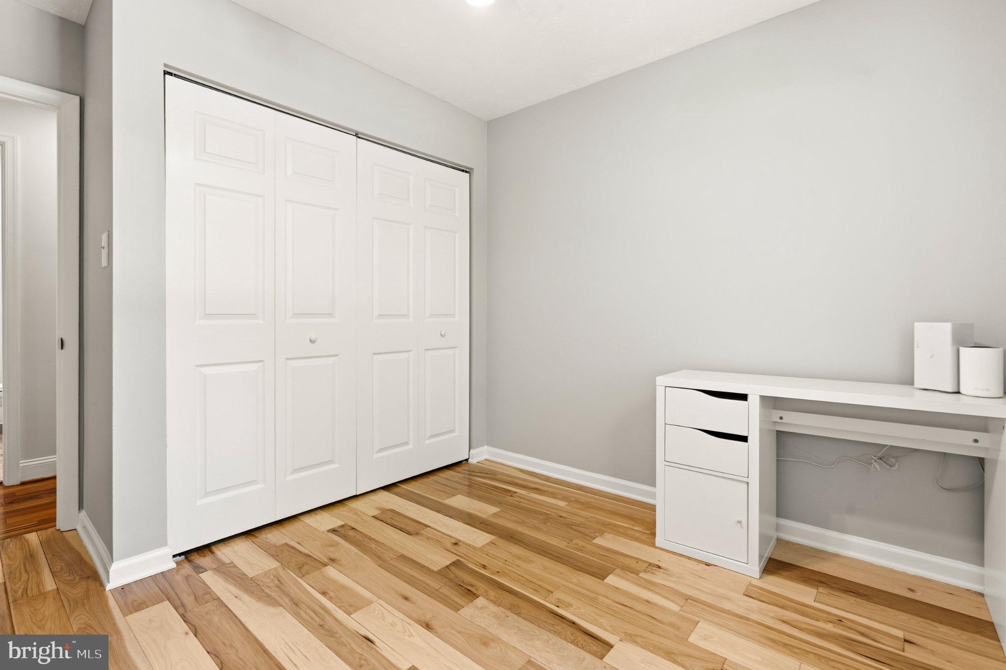 7845 Metacomet Road Hanover, MD 21076 - Photo 7 of 19 a view of a room with wooden floor and cabinet