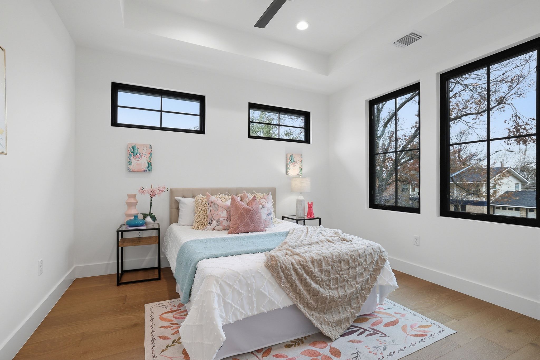 6611 Lexington Road Austin, TX 78757 - Photo 25 of 37 Bright room featuring light wood-finish flooring and a tray ceiling with a recessed light fixture