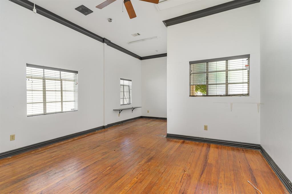 2602 Kings Road, Unit A Dallas, TX 75219 - Photo 8 of 12 Spare room featuring a ceiling fan, ornamental molding, wood-type flooring, and baseboards