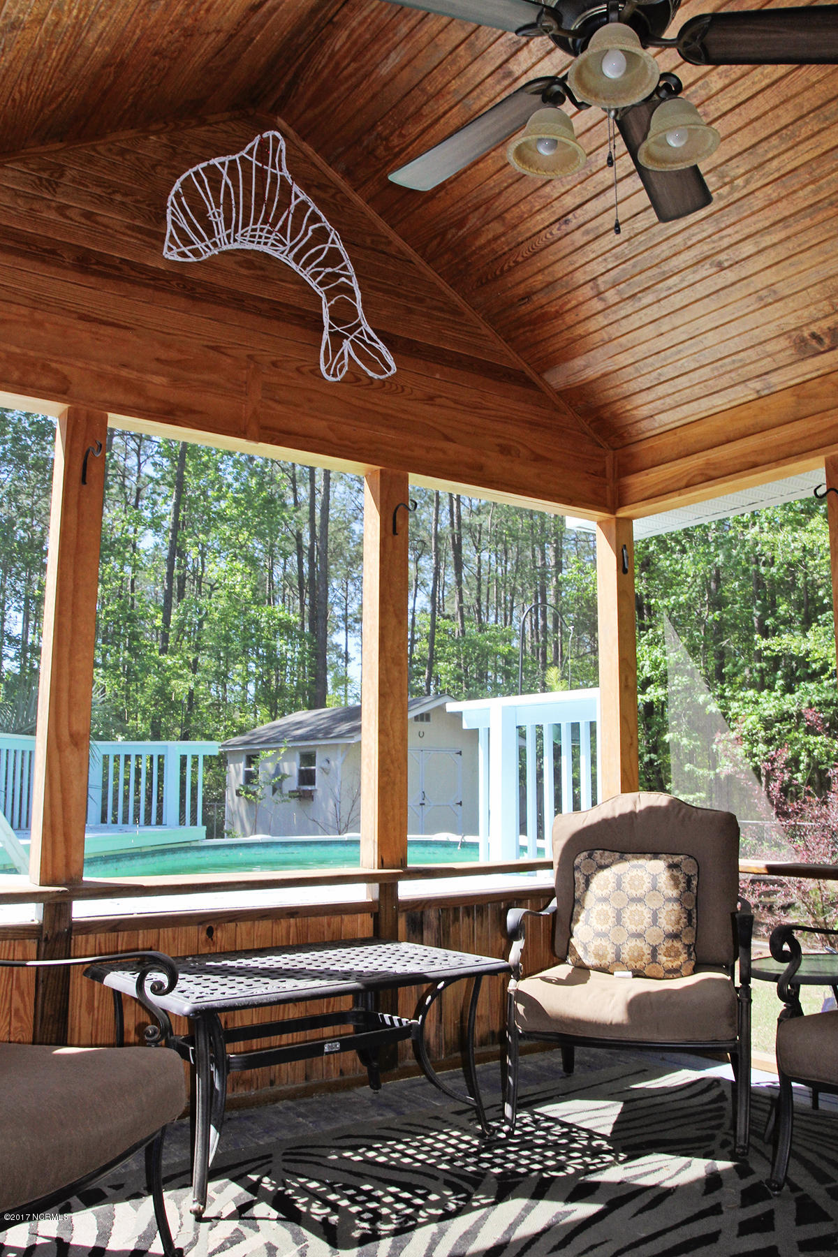 768 Straits Road Gloucester, NC 28528 - Photo 22 of 32 Screen porch by pool