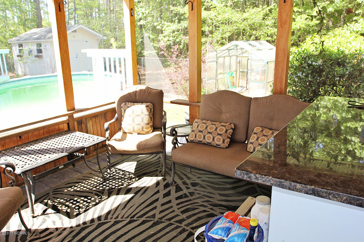 768 Straits Road Gloucester, NC 28528 - Photo 23 of 32 Screened porch