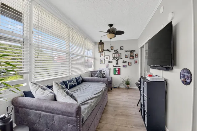 an aerial view of house with yard swimming pool and outdoor seating